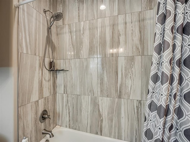 bathroom with shower / tub combo with curtain