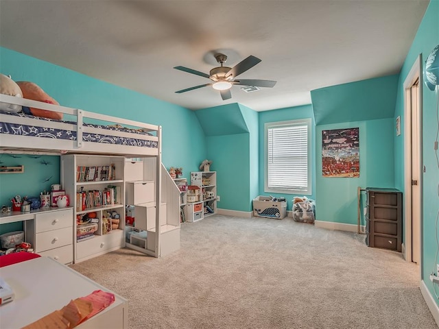 bedroom featuring ceiling fan, vaulted ceiling, and light carpet