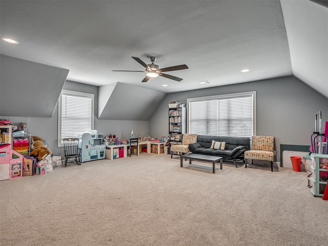 recreation room with carpet floors, vaulted ceiling, and ceiling fan