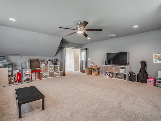 rec room featuring vaulted ceiling, ceiling fan, and carpet