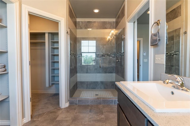 bathroom with vanity, tile patterned floors, and walk in shower