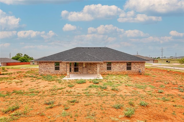 rear view of property featuring a patio