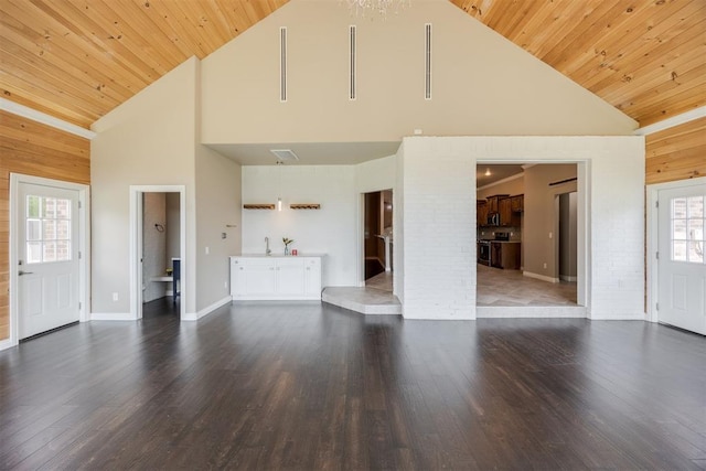 unfurnished living room with sink, high vaulted ceiling, wooden ceiling, and dark hardwood / wood-style floors