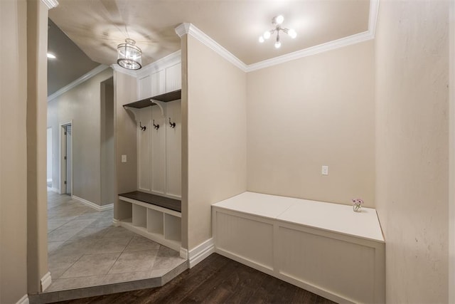 mudroom with a chandelier, dark hardwood / wood-style floors, and ornamental molding