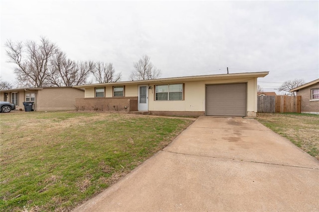 ranch-style home with a garage and a front lawn