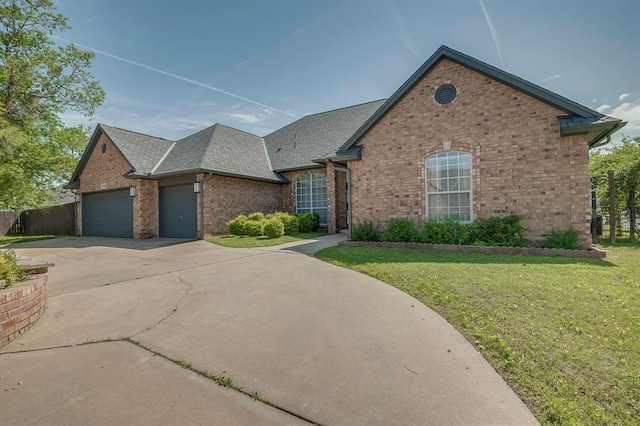 view of front of house with a garage and a front yard