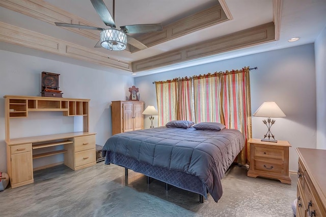 bedroom with a tray ceiling, ceiling fan, and ornamental molding