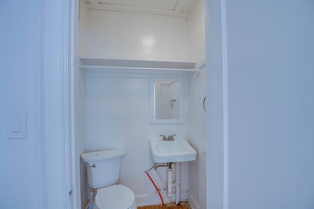 bathroom with sink and toilet