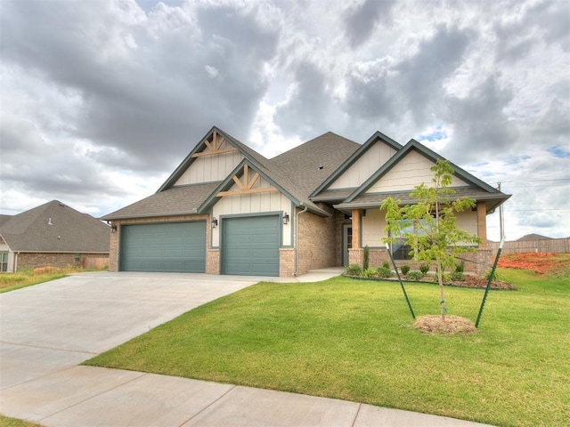 craftsman inspired home featuring a garage and a front yard