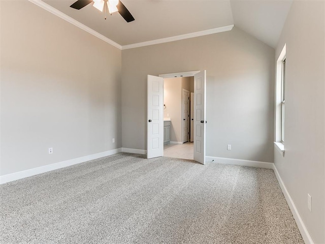 unfurnished bedroom with ceiling fan, crown molding, light carpet, and vaulted ceiling