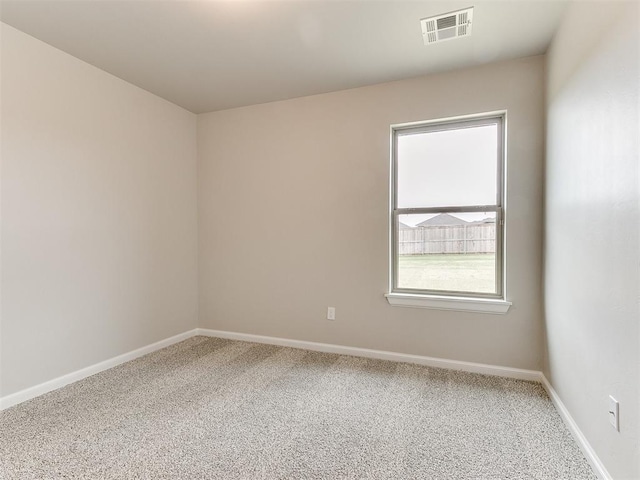 empty room with carpet flooring