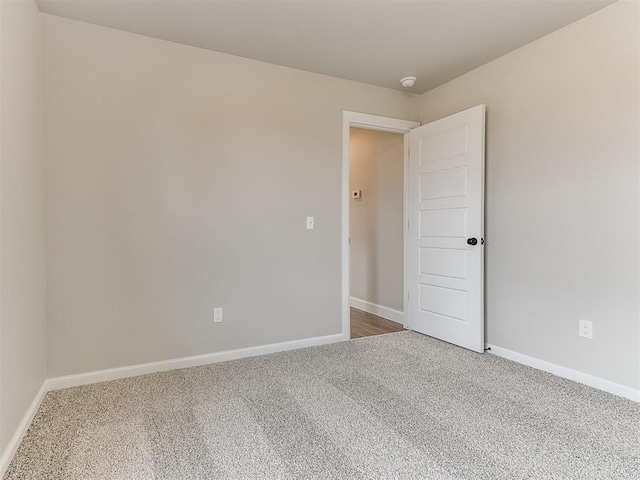 spare room featuring carpet floors