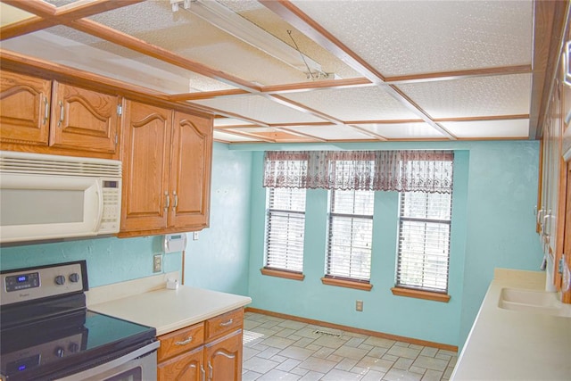 kitchen featuring electric range and sink