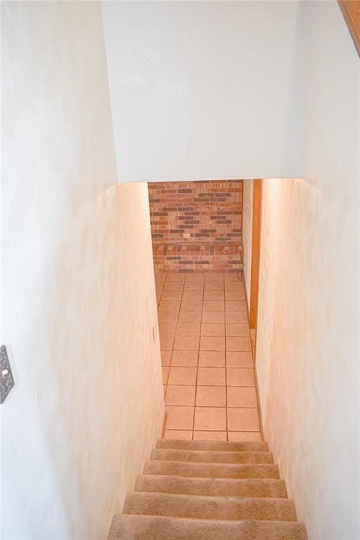 staircase with tile patterned floors