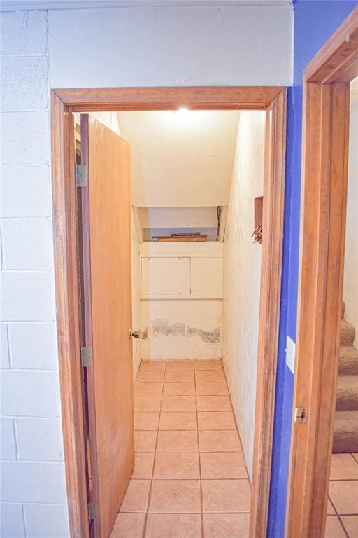 corridor with light tile patterned floors