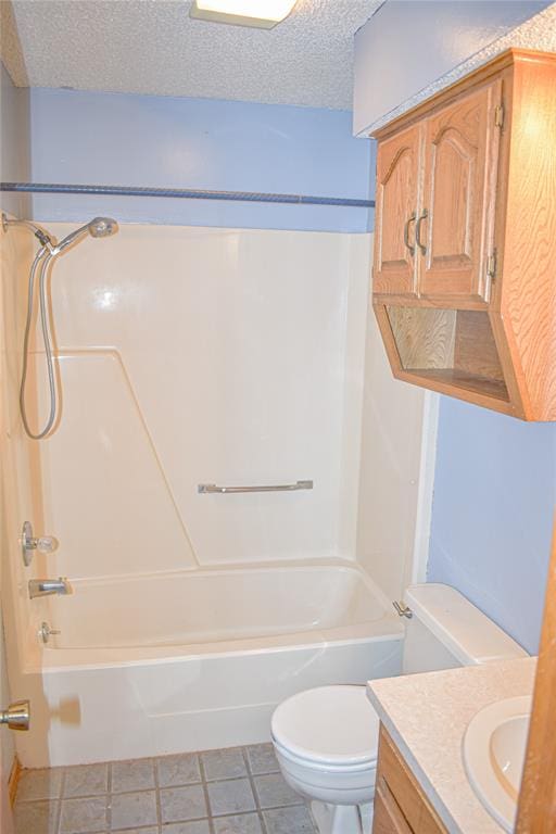 full bathroom with shower / bathtub combination, vanity, a textured ceiling, tile patterned flooring, and toilet