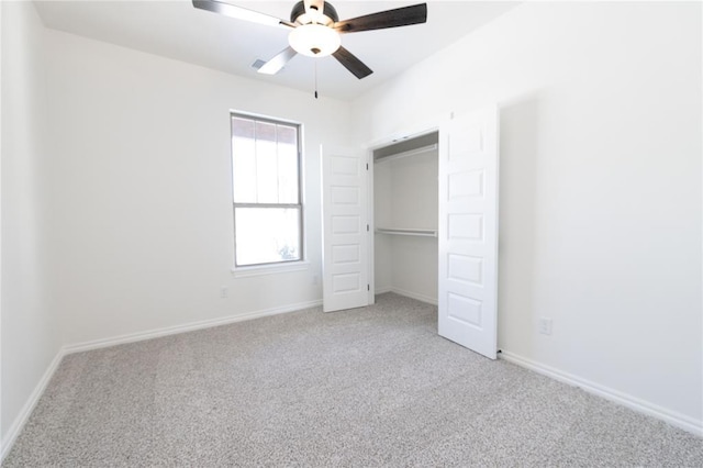 unfurnished bedroom with light carpet, a closet, baseboards, and a ceiling fan