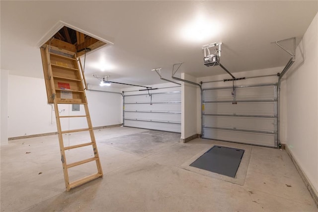 garage with baseboards and a garage door opener