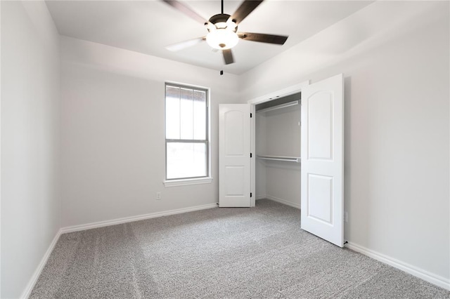 unfurnished bedroom with ceiling fan and carpet flooring