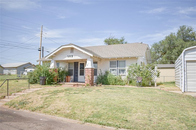 view of front of property featuring a front yard and a porch