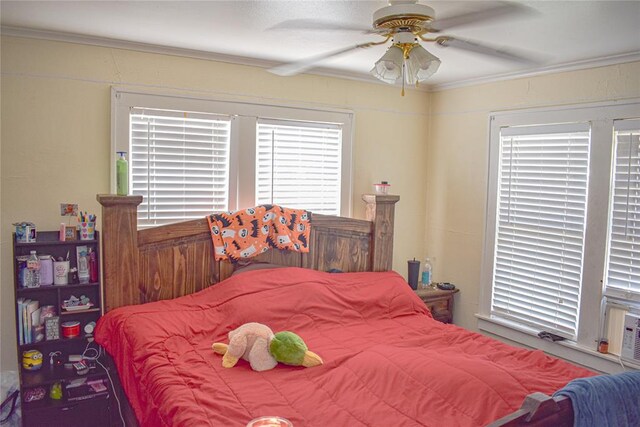 bedroom featuring ceiling fan and crown molding