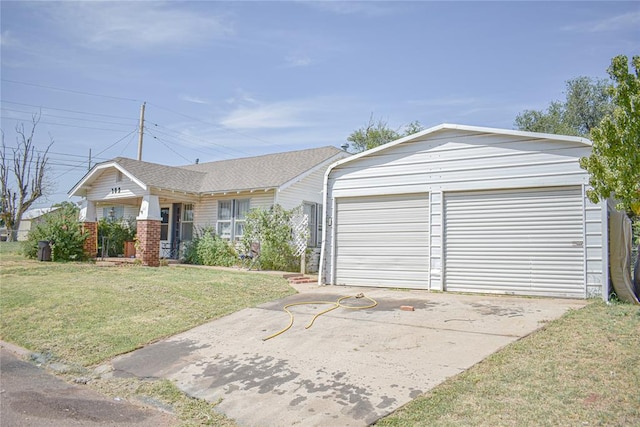 ranch-style house featuring a porch, a garage, and a front lawn