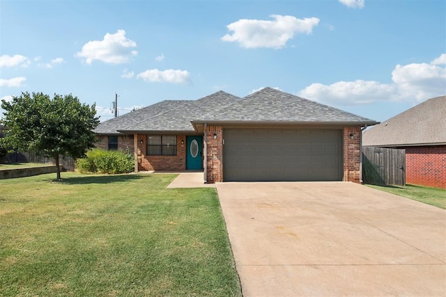 view of front of property with a front lawn and a garage