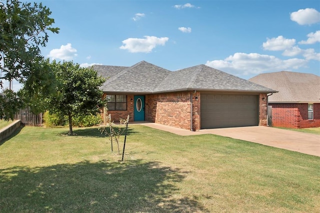 view of front of house with a front yard and a garage