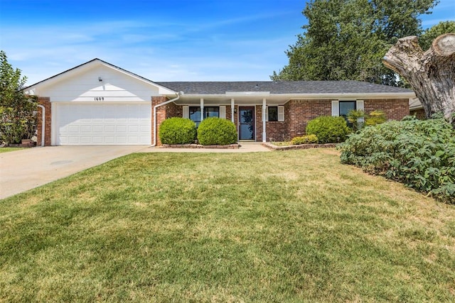 ranch-style home with a front yard and a garage