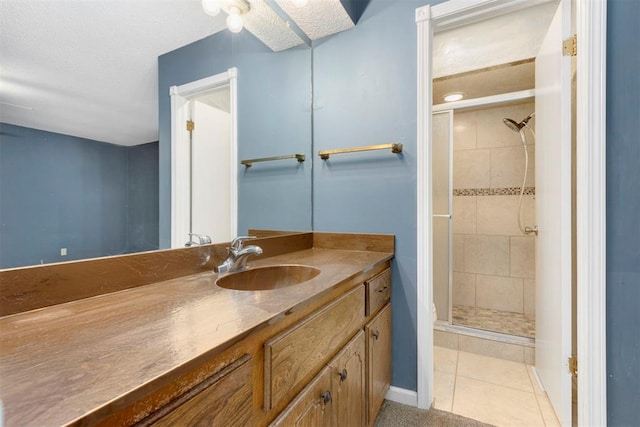 bathroom featuring vanity, tile patterned floors, and an enclosed shower