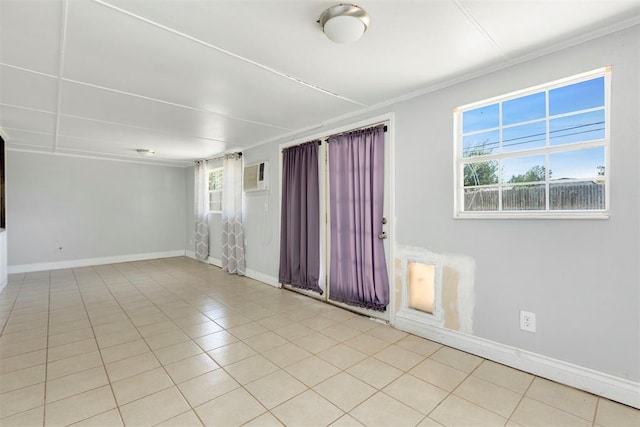 tiled empty room with a wall mounted air conditioner and ornamental molding