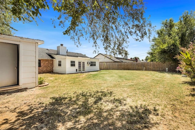 view of yard with french doors