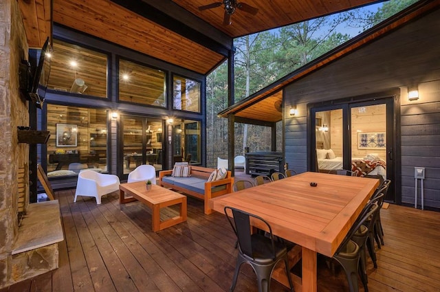 deck featuring ceiling fan, an outdoor hangout area, and grilling area