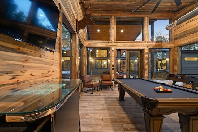 recreation room featuring wood ceiling, wooden walls, high vaulted ceiling, hardwood / wood-style floors, and pool table