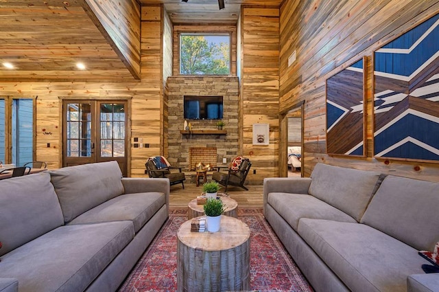 living room featuring hardwood / wood-style floors, plenty of natural light, and wooden walls