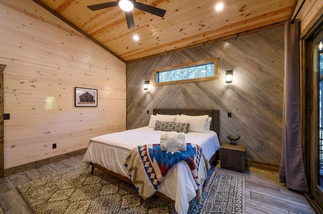 bedroom with ceiling fan, wooden ceiling, wood-type flooring, vaulted ceiling, and wooden walls