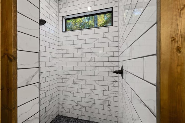 bathroom with tiled shower