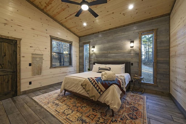 bedroom with wood walls, ceiling fan, dark wood-type flooring, and wooden ceiling