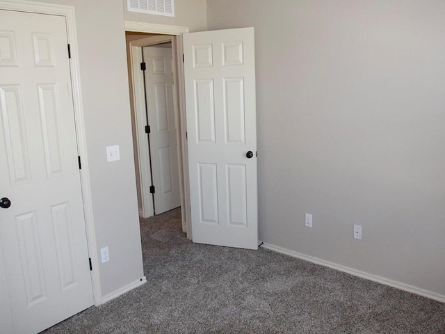 unfurnished bedroom with carpet flooring