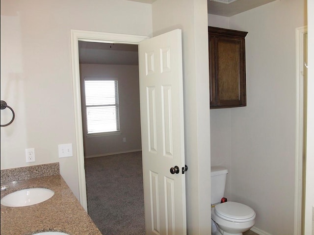 bathroom with vanity and toilet