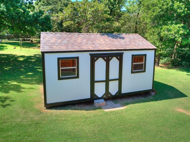 view of outdoor structure with a lawn