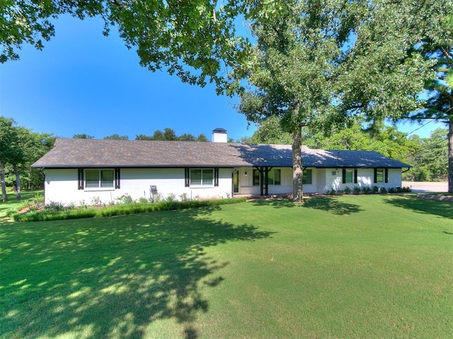 single story home with a front lawn