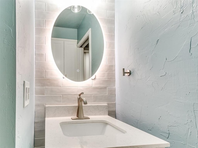 bathroom featuring backsplash and vanity