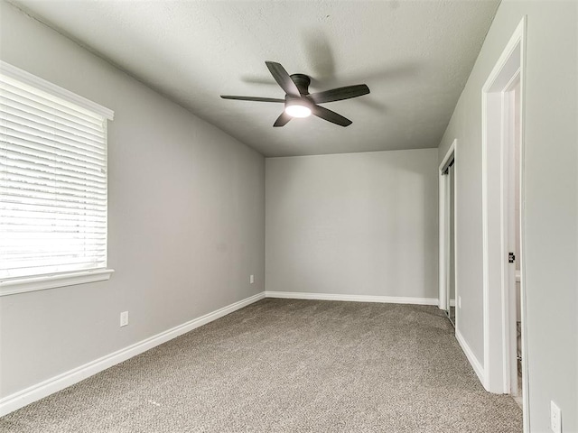 unfurnished bedroom with carpet and ceiling fan