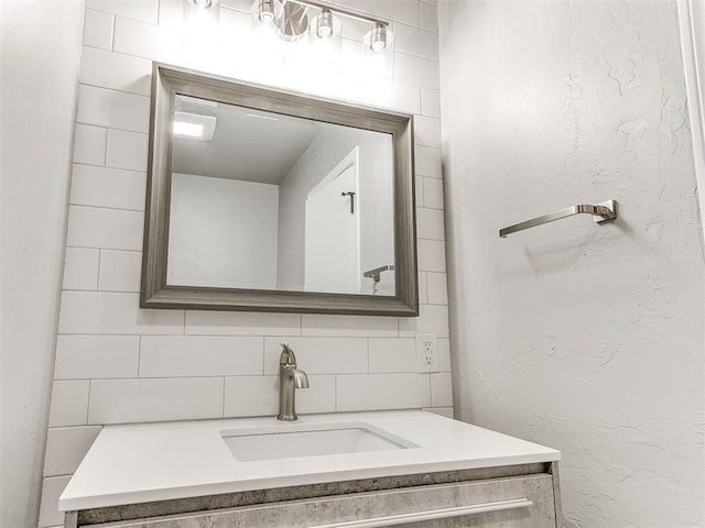 bathroom with vanity and backsplash