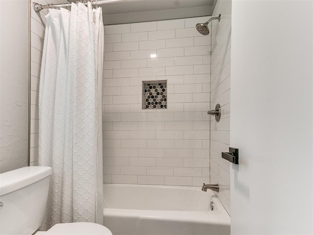 bathroom featuring toilet and shower / bathtub combination with curtain