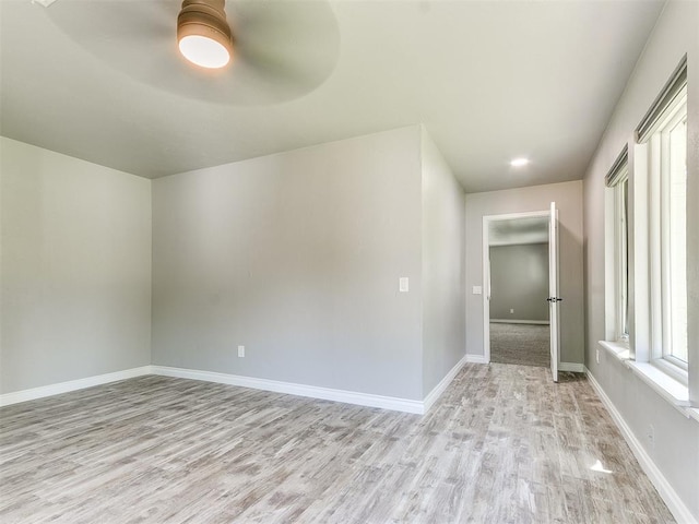 interior space with light hardwood / wood-style flooring and ceiling fan