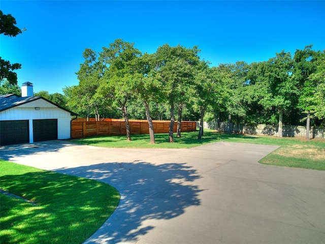 exterior space with a yard and a garage