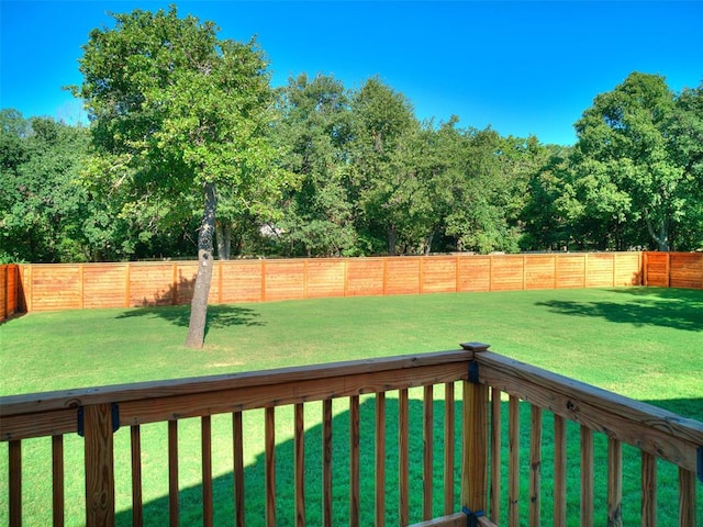 wooden deck with a lawn