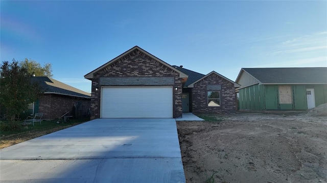 view of front of property with a garage